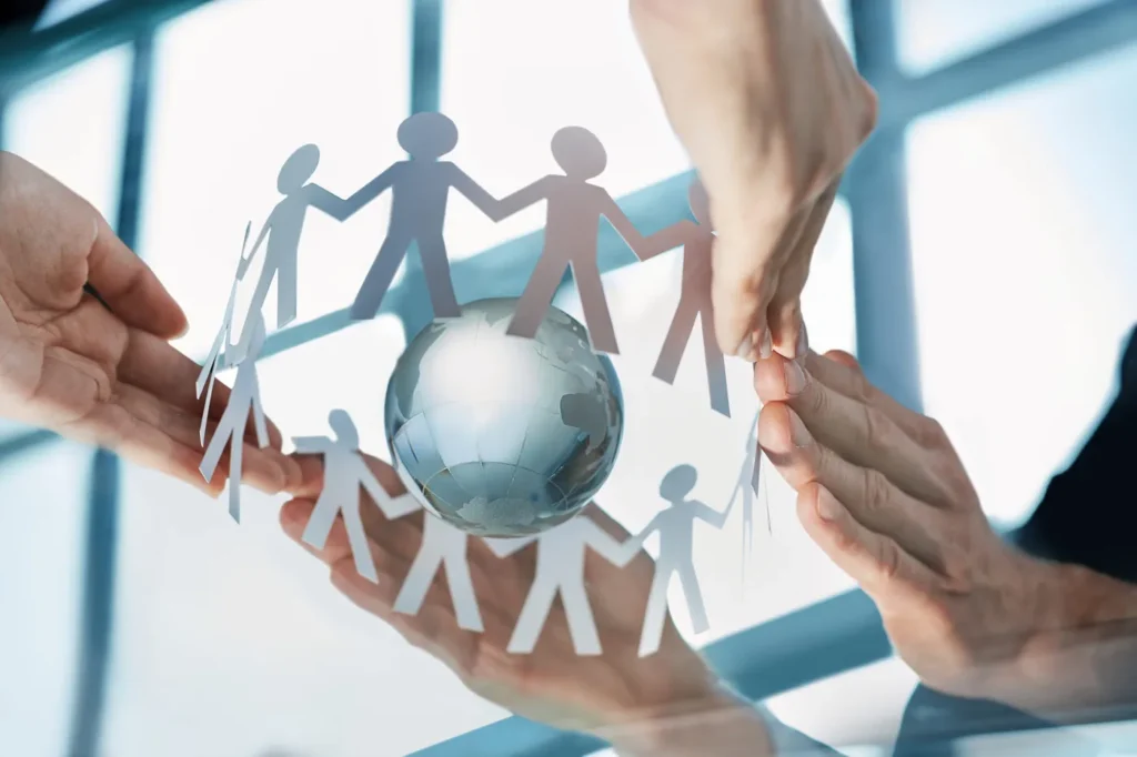 closeup-team-paper-men-hands-business-people-scaled